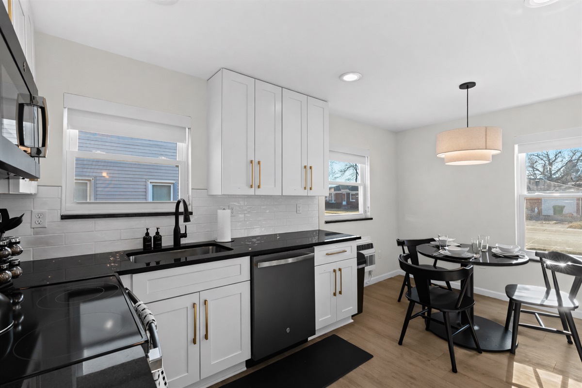 Bright, open kitchen and dining area with modern appliances, sleek finishes, and plenty of natural light—perfect for cooking, dining, and entertaining.