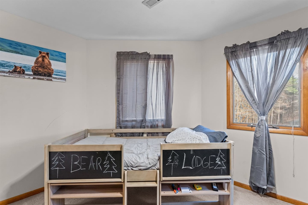 Bedroom 3 Bear Lodge: Kids will love this fun-themed space with natural light and playful decor!