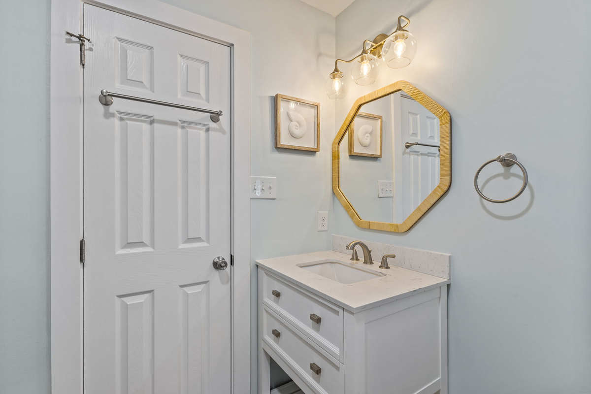 Fresh, bright, and thoughtfully designed, the main-level bathroom makes getting ready for the day feel effortless