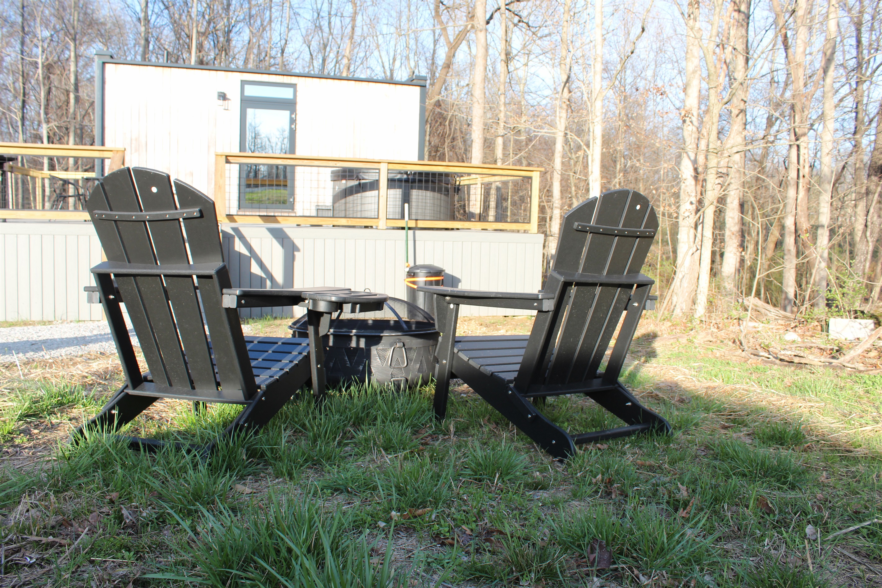 Firepit with two adirondack chairs