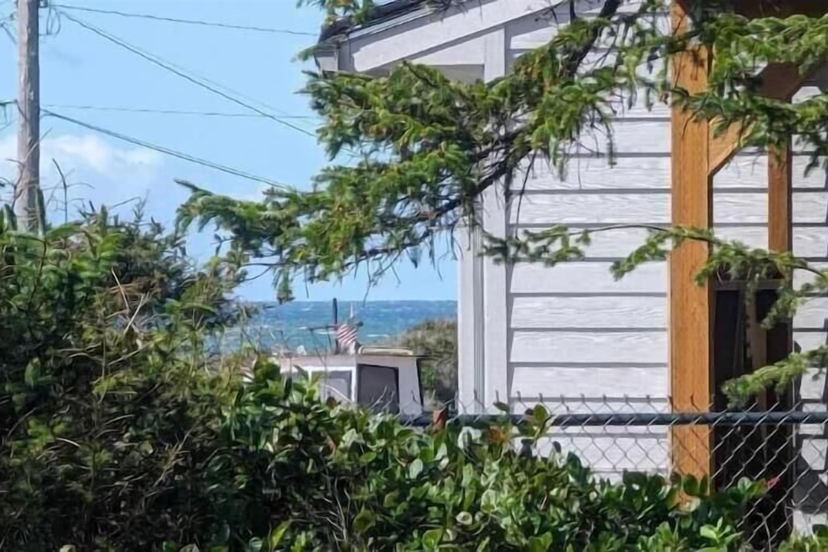 a distant peek of the ocean from the deck