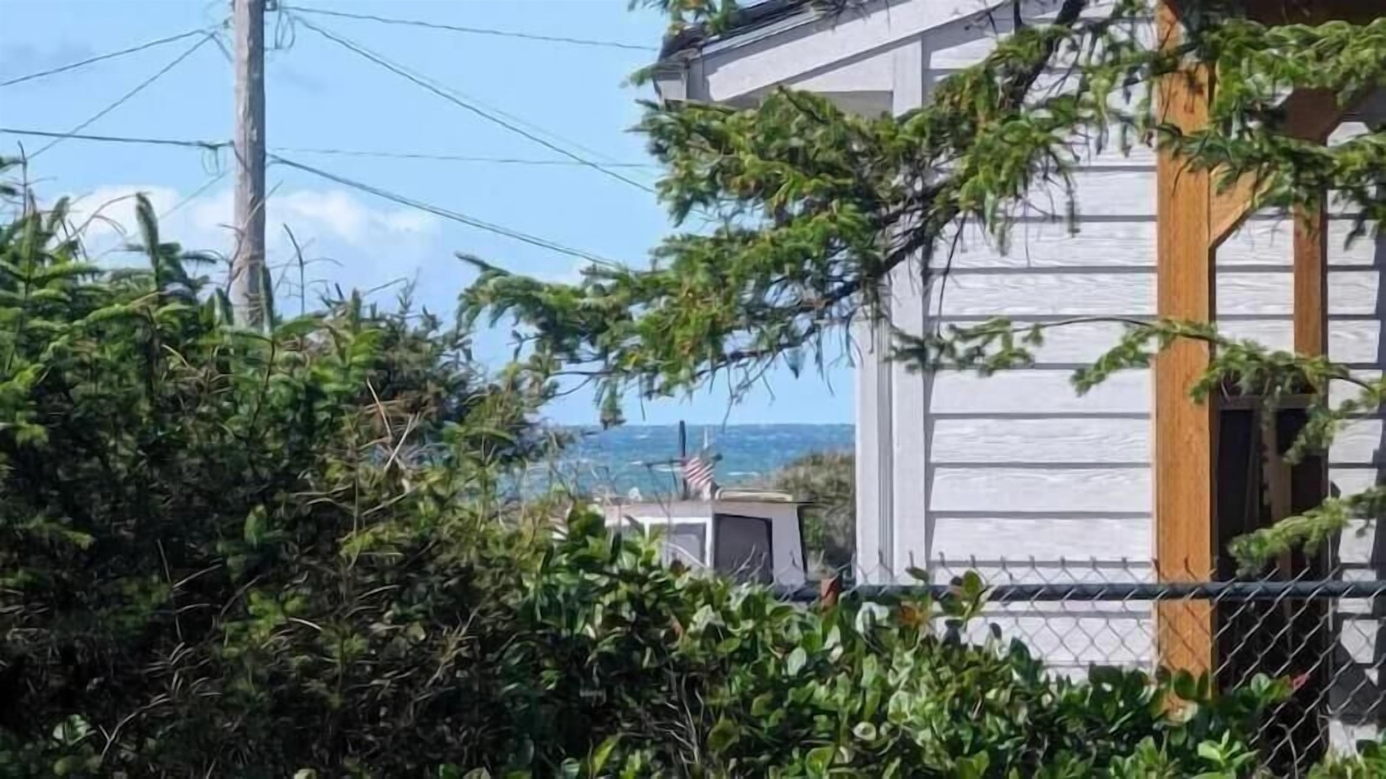 a distant peek of the ocean from the deck