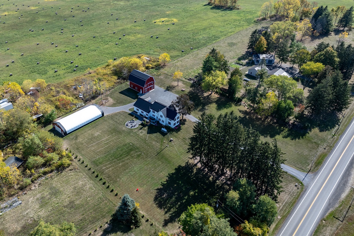 Classic red barn and cozy farmhouse set on acres of peaceful countryside in the Finger Lakes