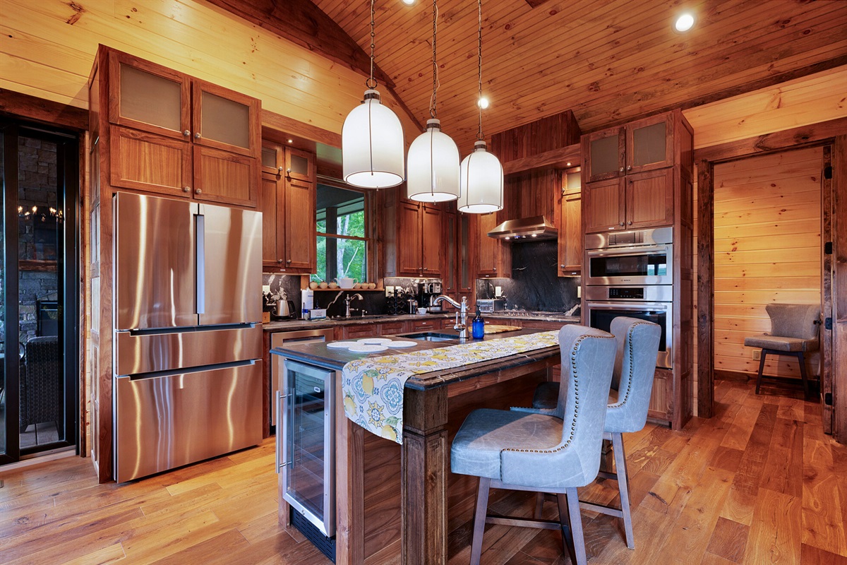 This kitchen has everything you need for preparing delicious meals, complete with modern appliances and a rustic touch.