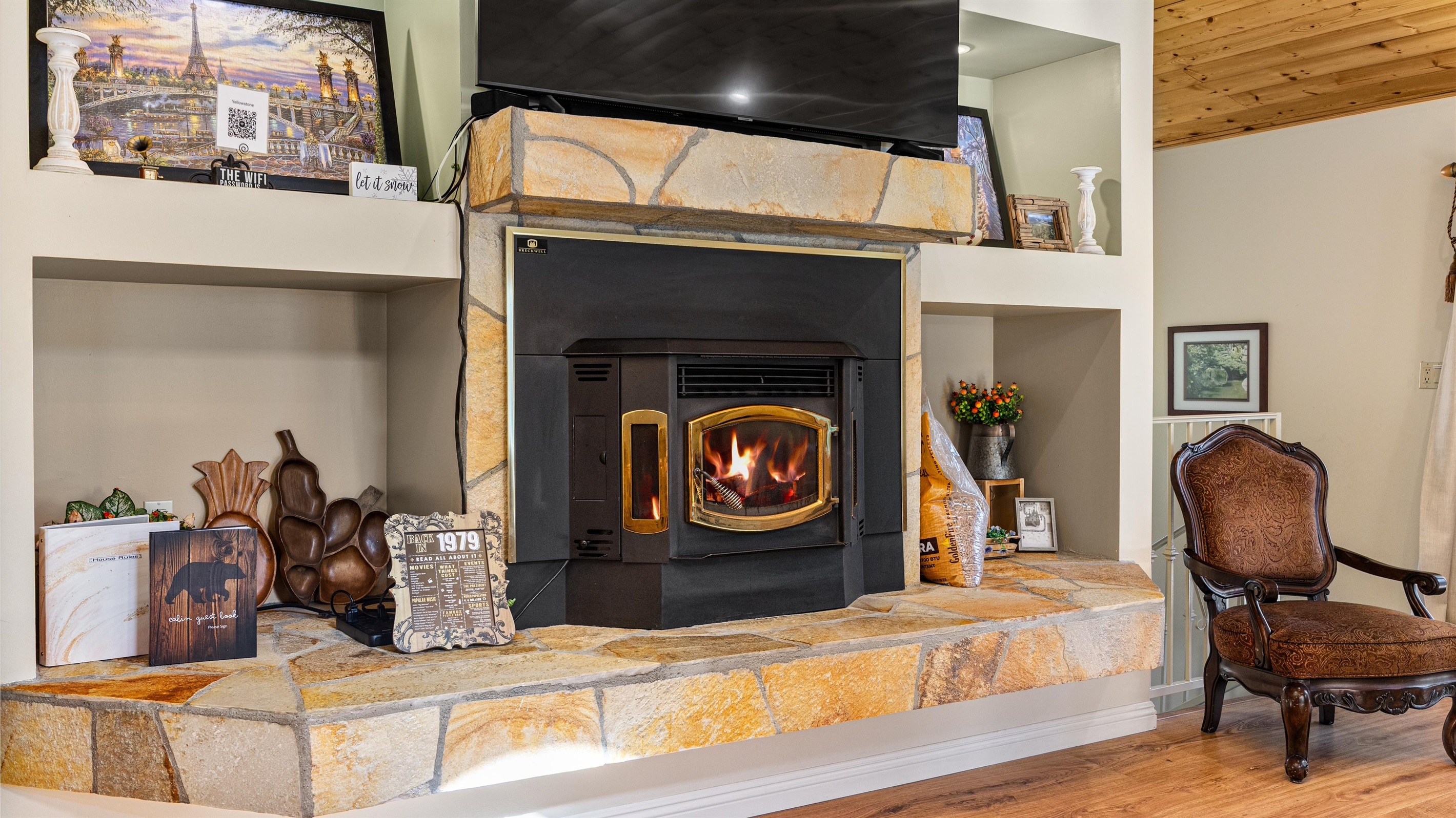 A cozy pellet stove anchors the living room, perfect for warm mountain nights.