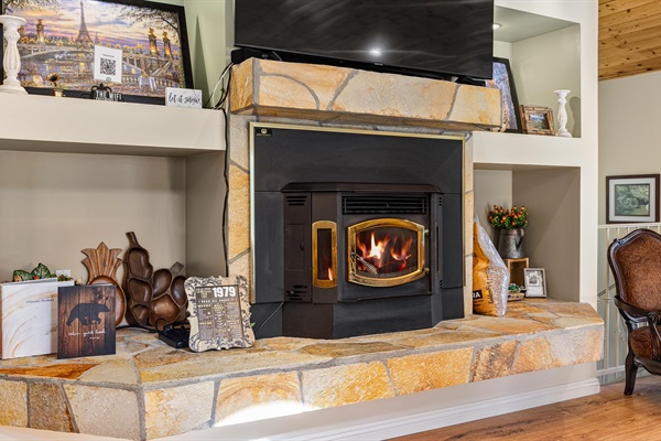 A cozy pellet stove anchors the living room, perfect for warm mountain nights.