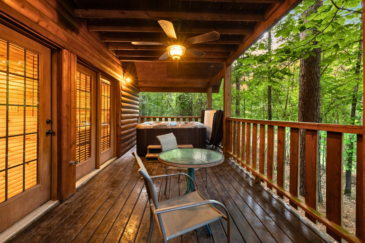 Covered deck with outdoor seating—perfect for morning coffee or evening wine.