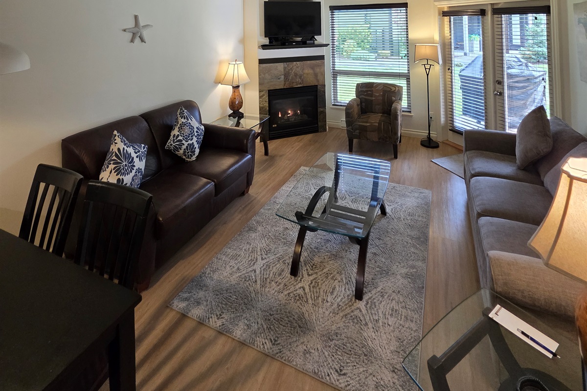 Unit A Living room area. Natural gas fireplace. Streaming TV. Double glass doors to private covered patio.