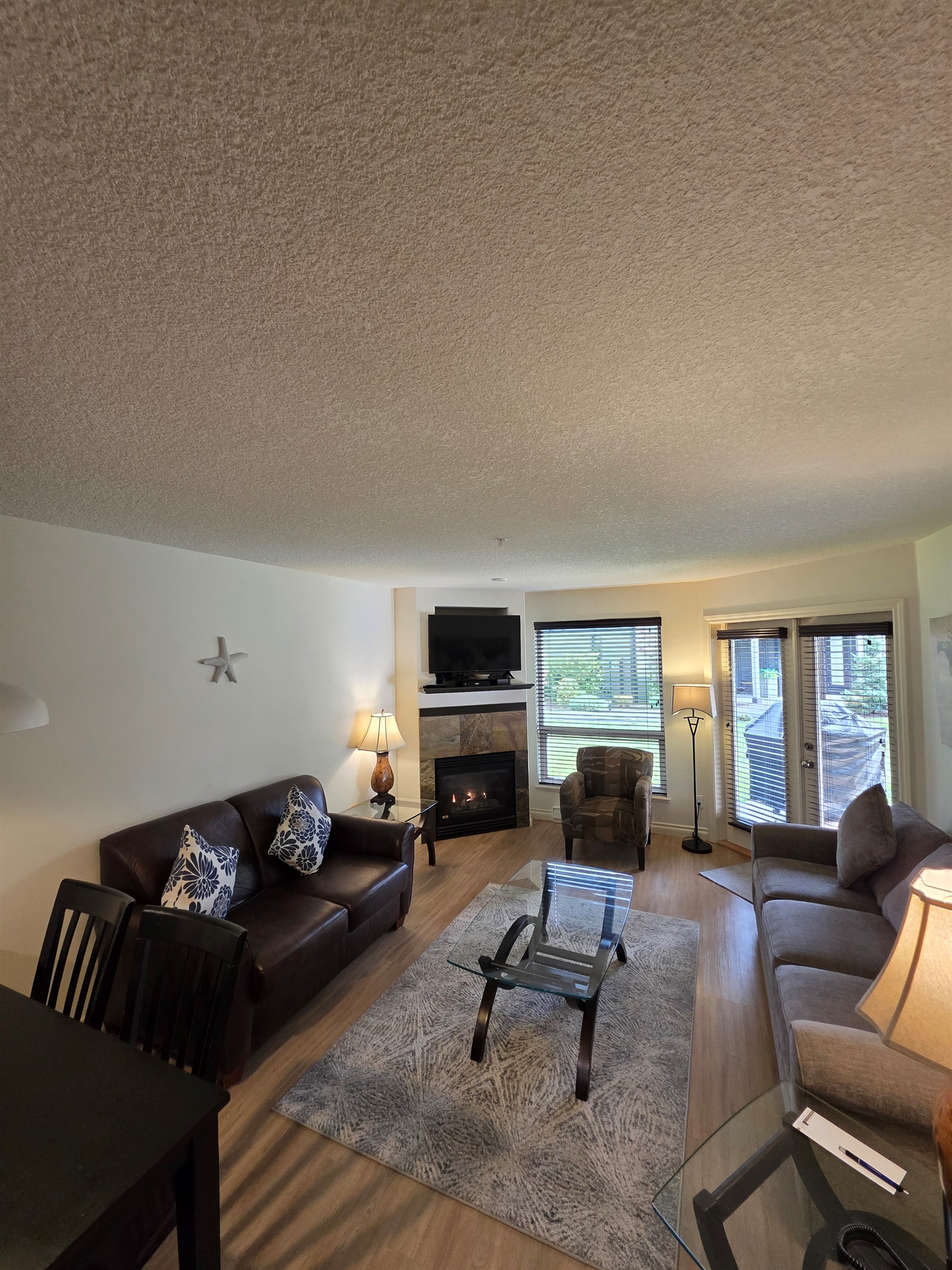 Unit A Living room area. Natural gas fireplace. Streaming TV. Double glass doors to private covered patio.