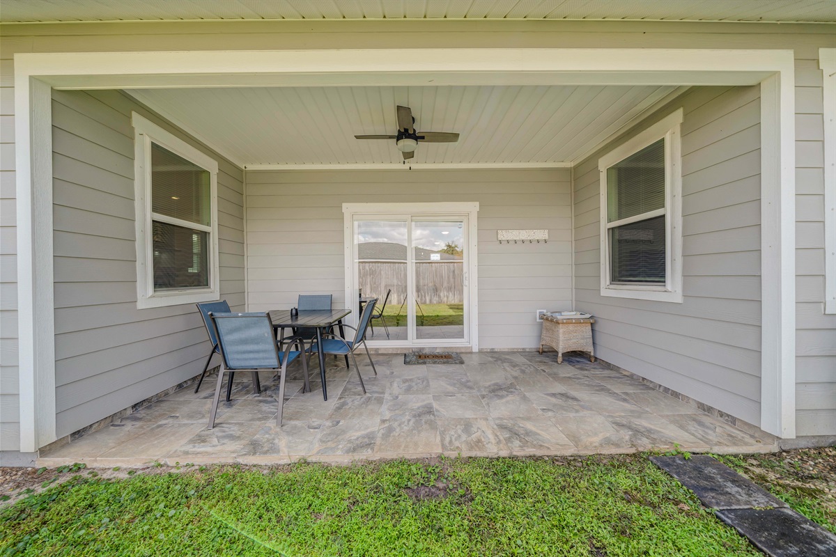 The flat green lawn is perfect for a friendly game of catch. You can easily watch the fun from the shade of the covered patio.
