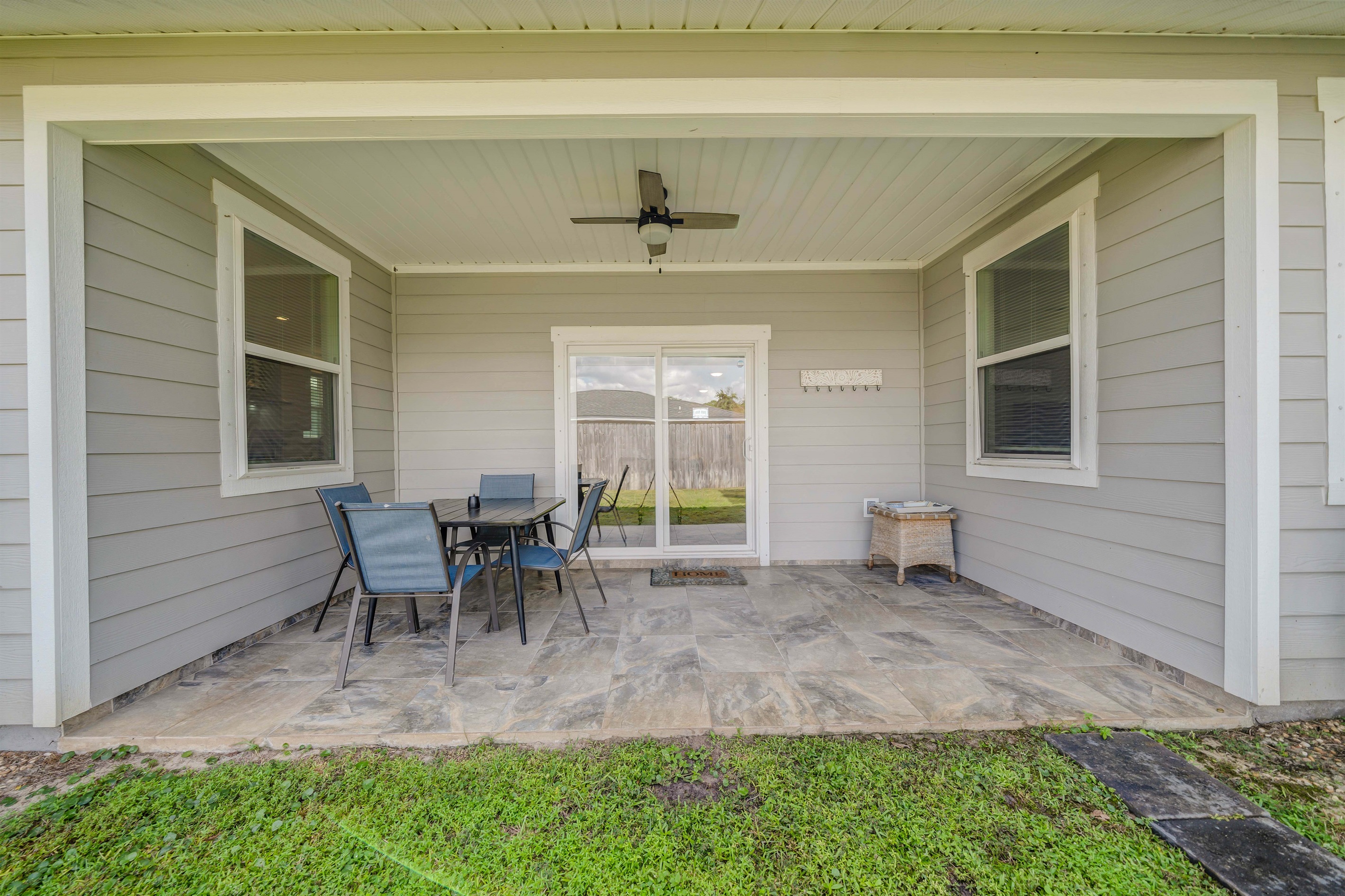 The flat green lawn is perfect for a friendly game of catch. You can easily watch the fun from the shade of the covered patio.