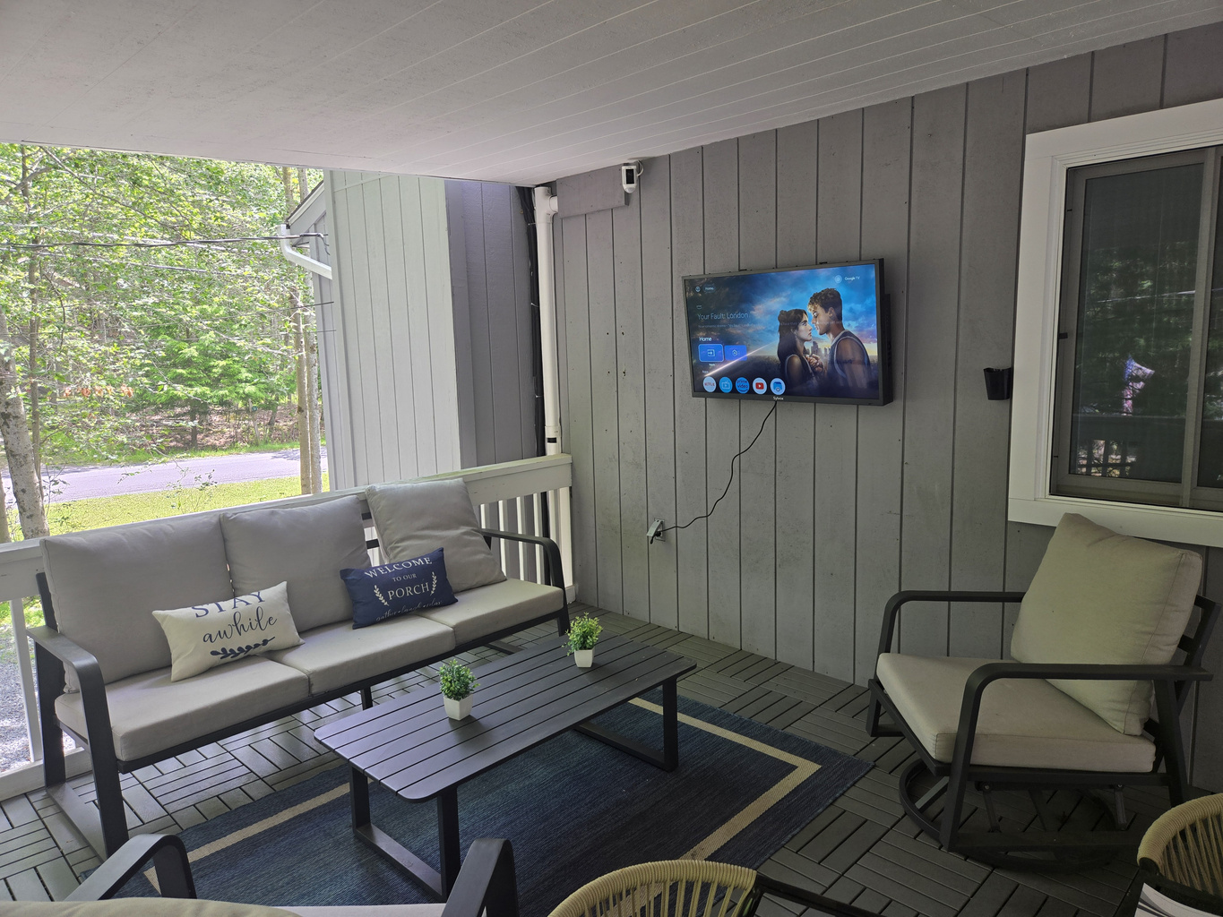 Unwind at the cozy outdoor table on the covered deck, perfect for enjoying a meal or morning coffee.