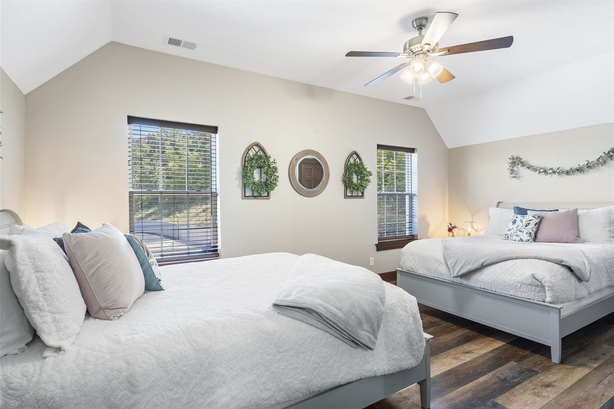 Two queen beds in upper level bedroom with Ensuite bathroom
