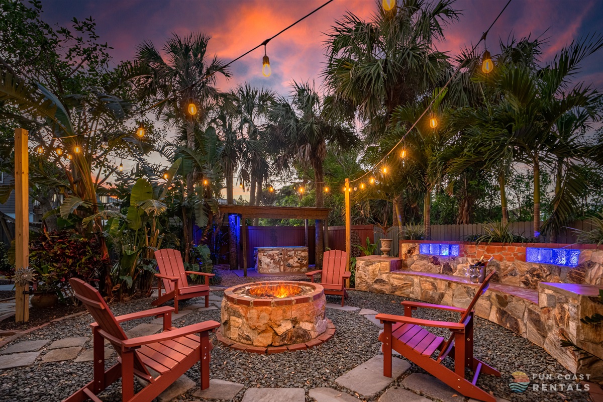 Private and inviting string lit zen Backyard with wood fire pit and bar!