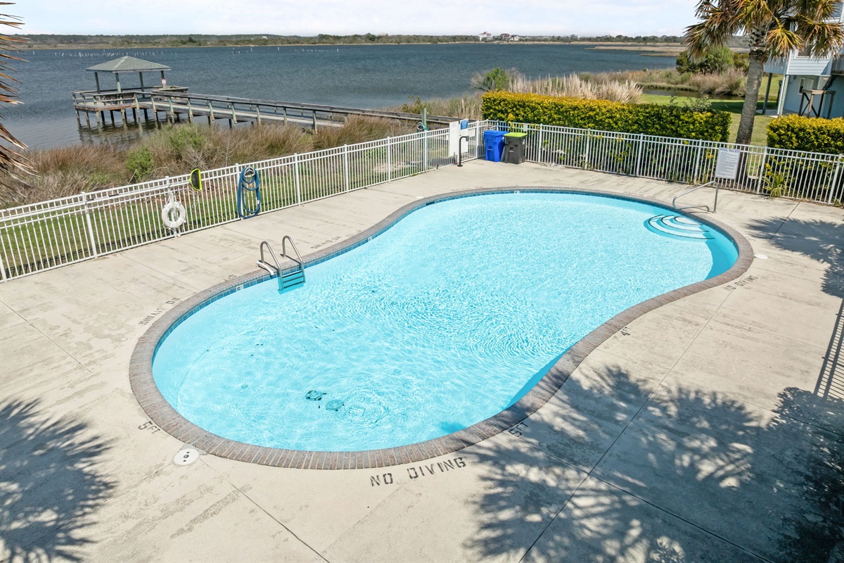 Community pool overlooking the sound and dock