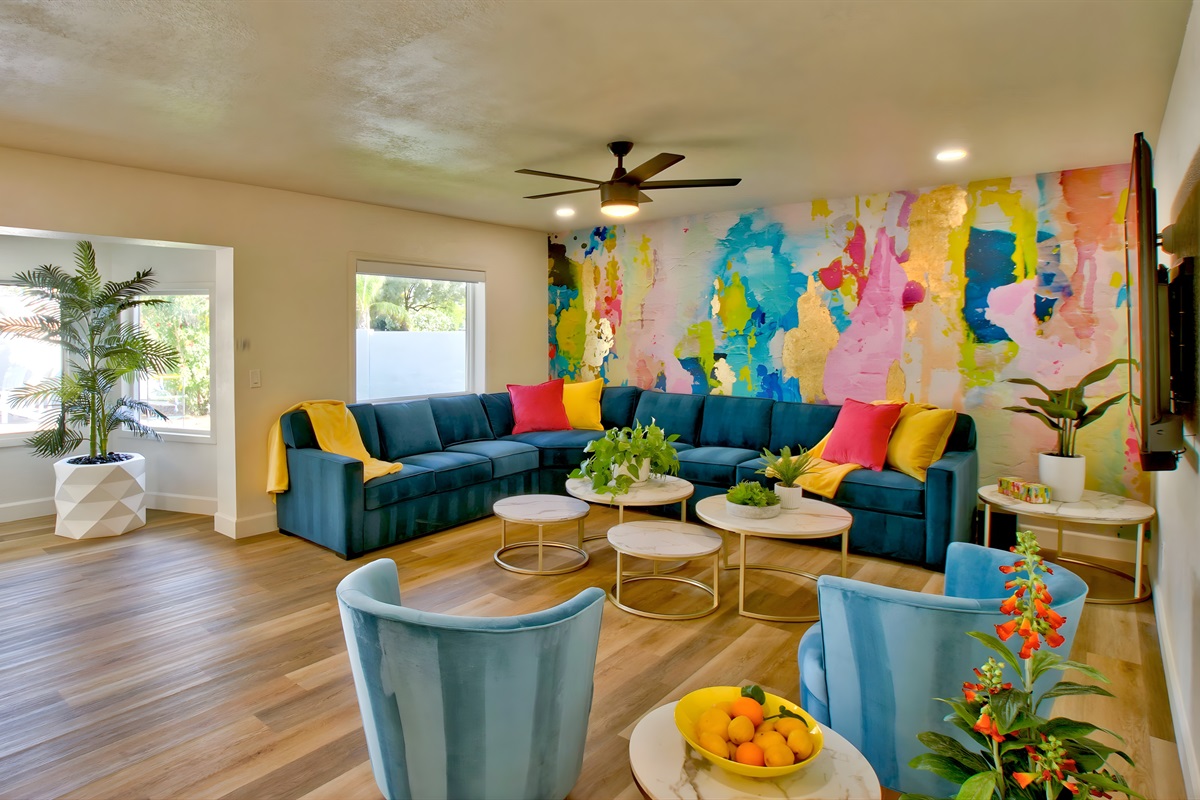 Colorful abstract mural and lounge seating | Queen Sleeper Pull-Out Sofa