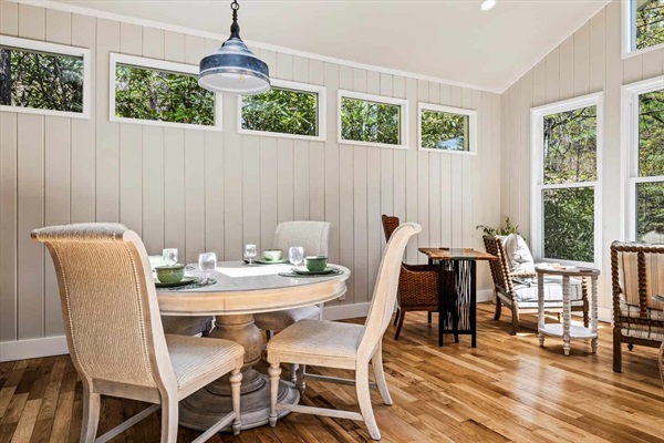 The dining table is set for four for a comfortable inside dining experience.