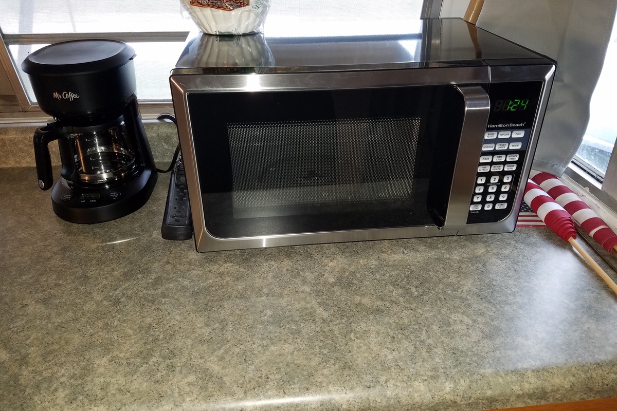 The mircrowave and coffee pot allows you to heat up quick meals and jumpstart your morning with coffee to get you ready to skydive quickly.