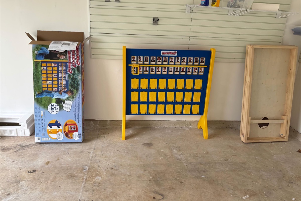 The fully fenced backyard is the centerpiece — fire up the propane BBQ grill, challenge your group to lifesize Guess Who, toss a round of cornhole, and settle in at the outdoor dining area under the covered patio with string lights.