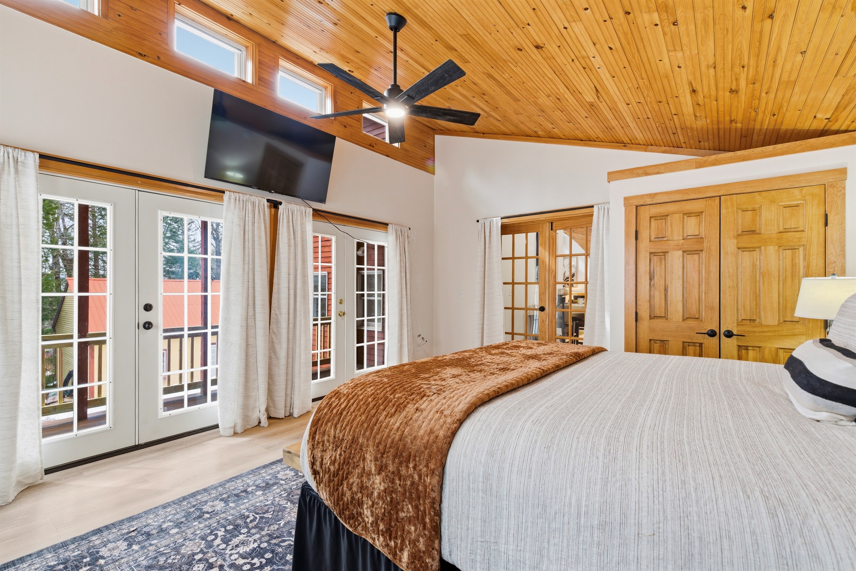 Wake up in comfort or unwind under the stars in the primary bedroom’s king bed and private porch.