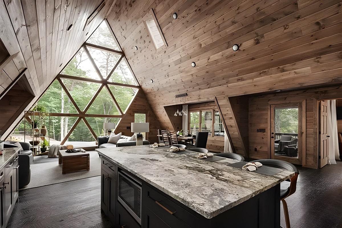 A kitchen where style meets function, marble island, clean lines, a space made for gathering.