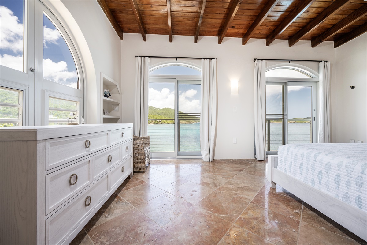 Main Floor Guest Bedroom: Every window reveals a postcard-worthy view of the Caribbean Sea.