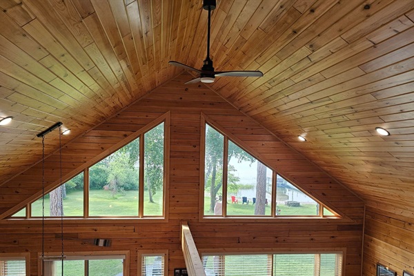 Bright, open living spaces with oversized windows and peaceful lake views