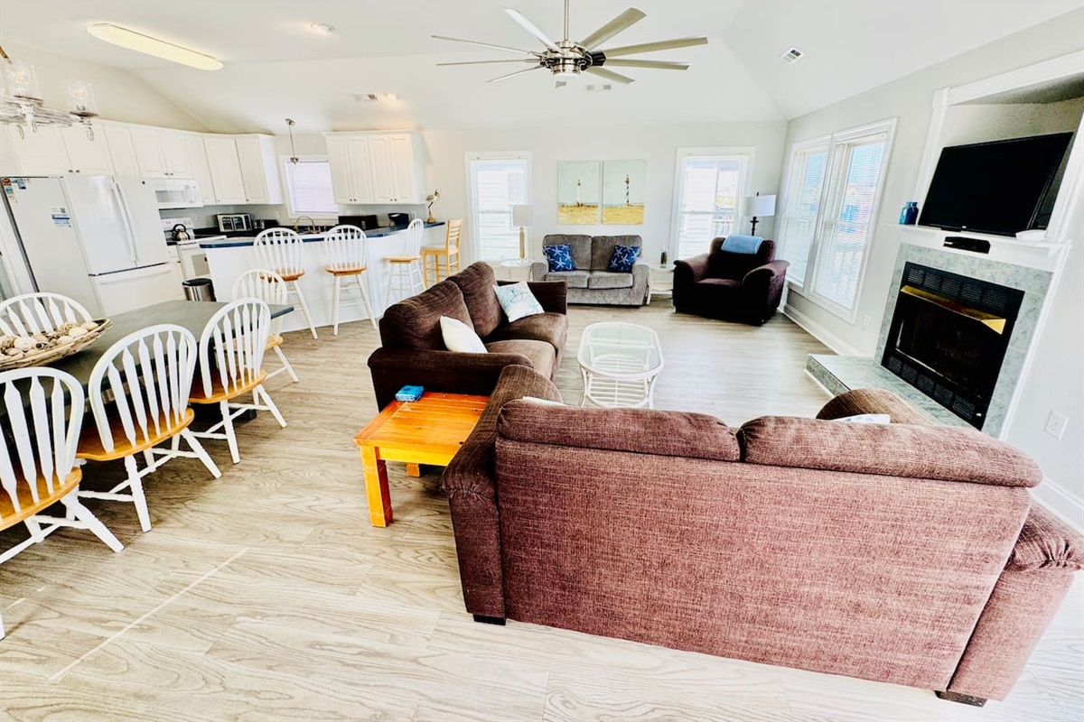 Cozy gathering space, open to kitchen and dining.