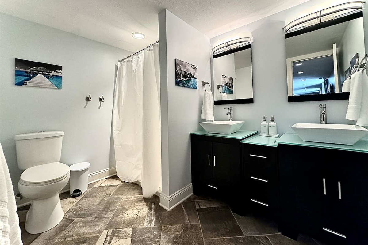 Spacious double vanity and walk-in shower in the Garden Level Double Bathroom.