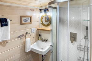 is small but equipped! Brand new stand up shower, toilet and vanity.