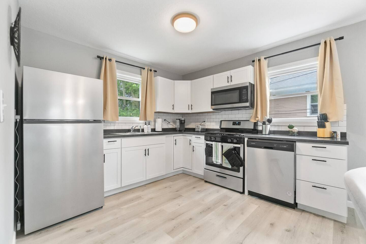 Fully equipped kitchen with all the essentials for cooking, including modern appliances and cookware.
