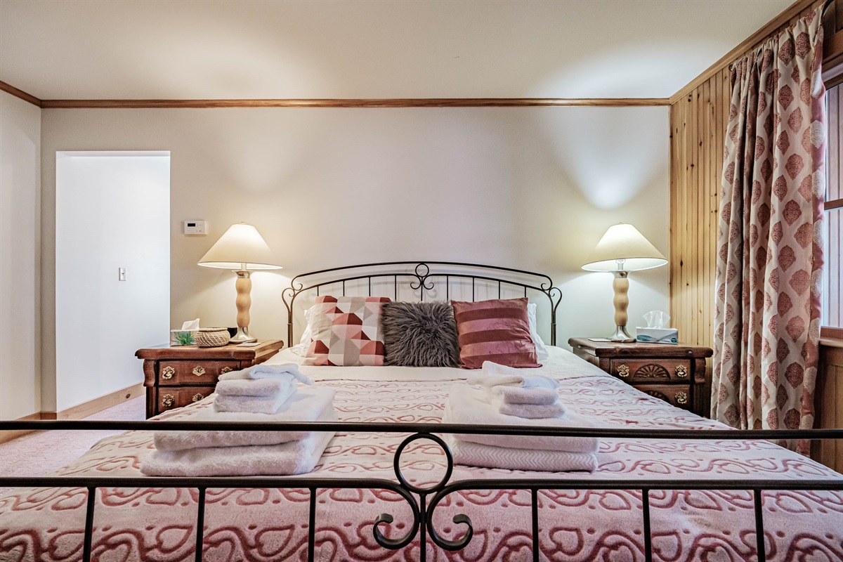 Master suite featuring a comfortable king bed.