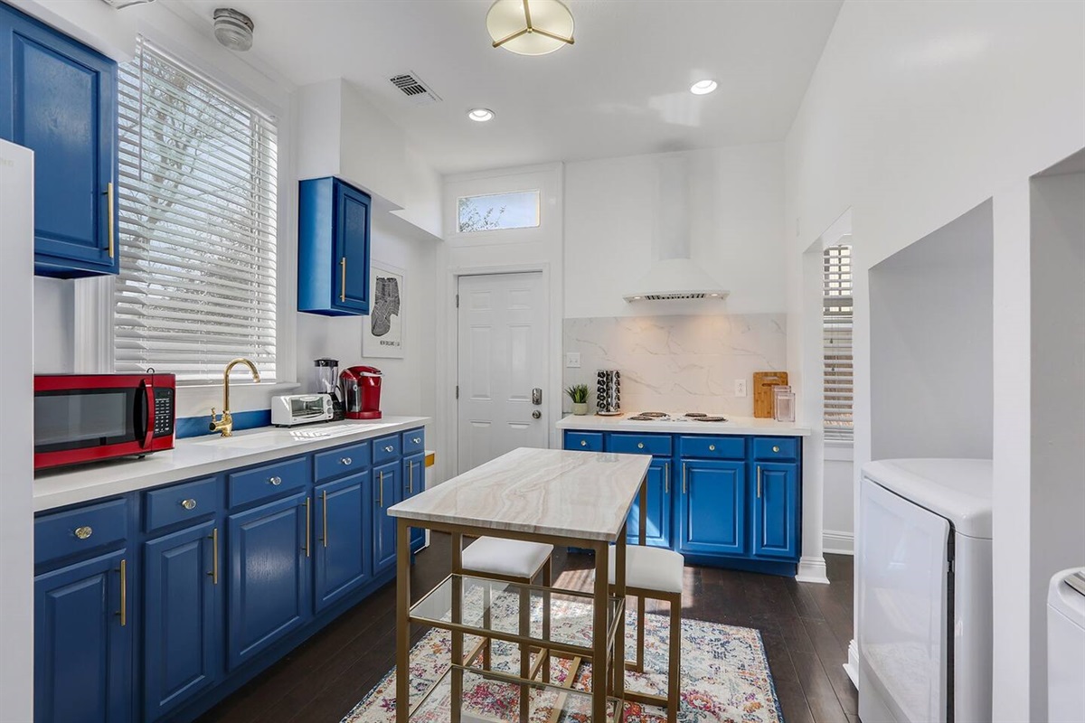 Full kitchen looking at entry door.