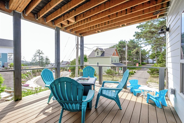 Lower deck featuring a gas fire pit and plenty of seating — the ideal spot for making memories together.