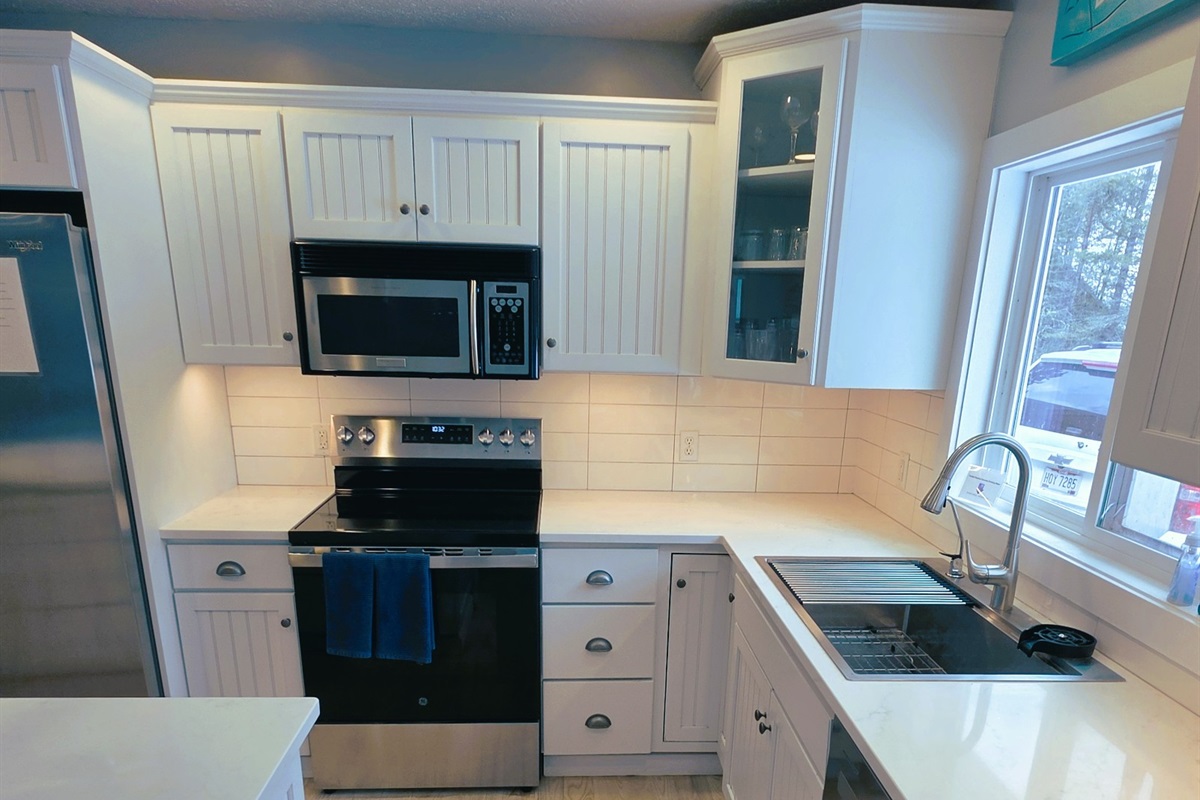 New kitchen Quartz counter tops and back splash 2026. Large bowl sink with glass wash and filtered drinking water