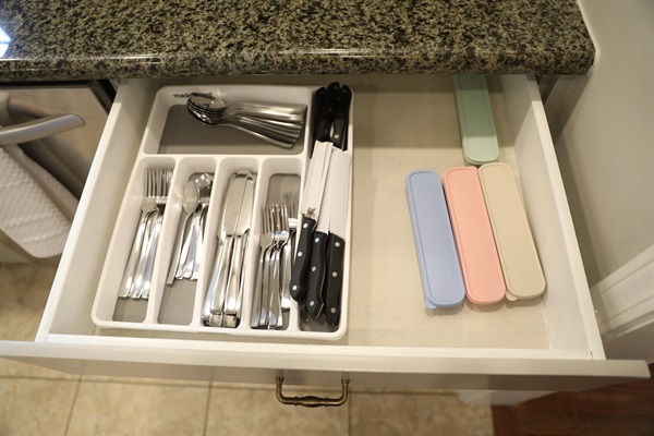 Kitchen drawer with kitchen flatware supplies