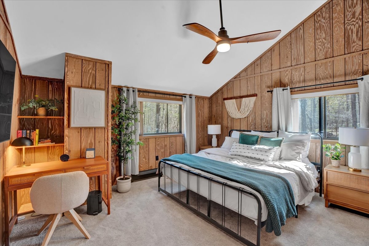 “Upper king suite with workspace and mid-century design touches.”