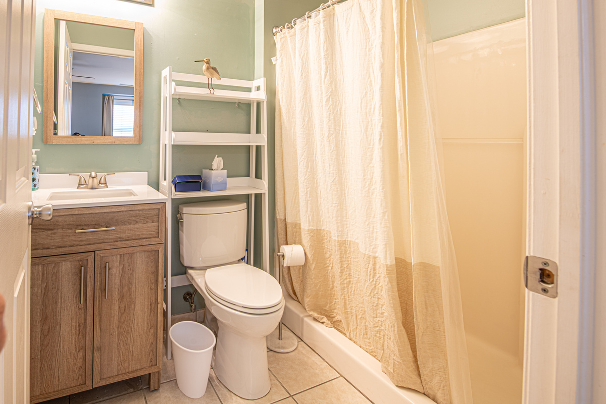 Bathroom 1 with Shelving Unit, and Shower
