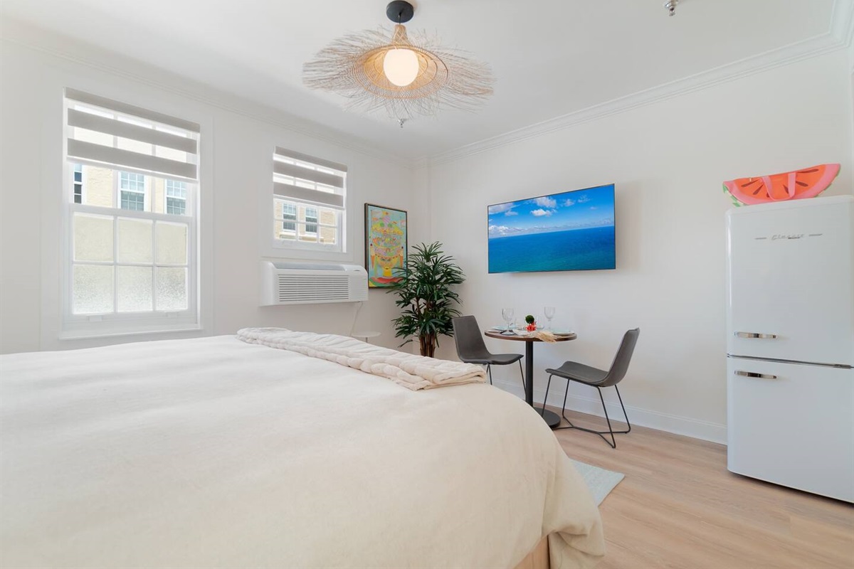 Straw hat light fixture by CB2.  55" new Sony HD Smart TV for your enjoyment.