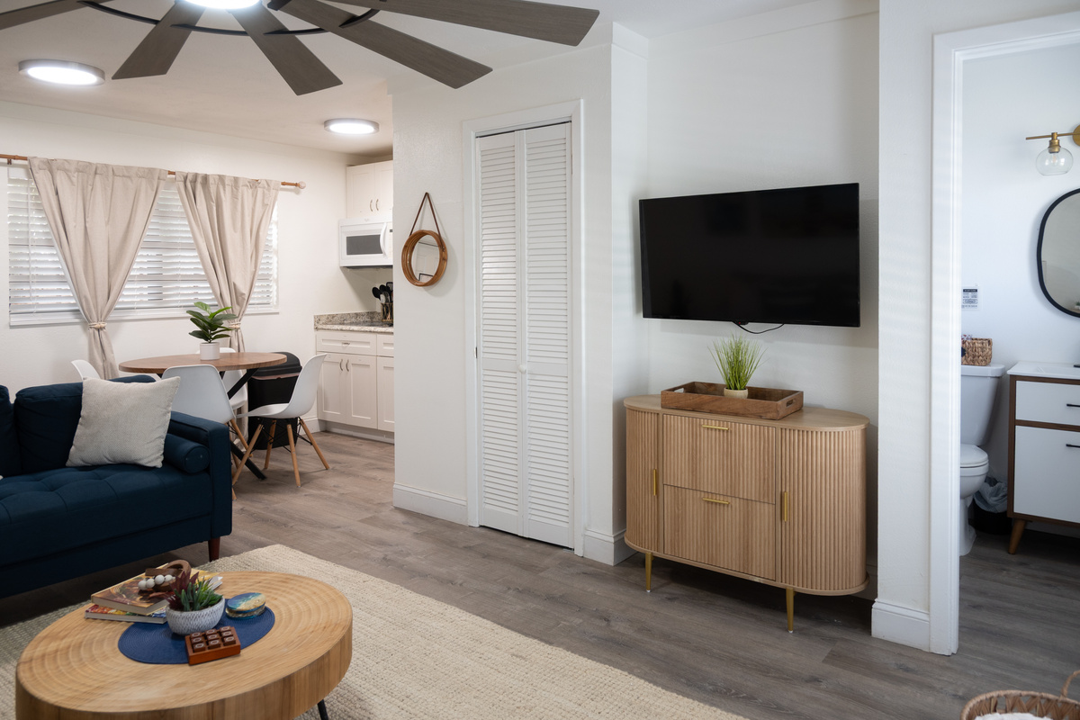 Living room with Smart TV, coastal art and sleeper sofa for extra guests
