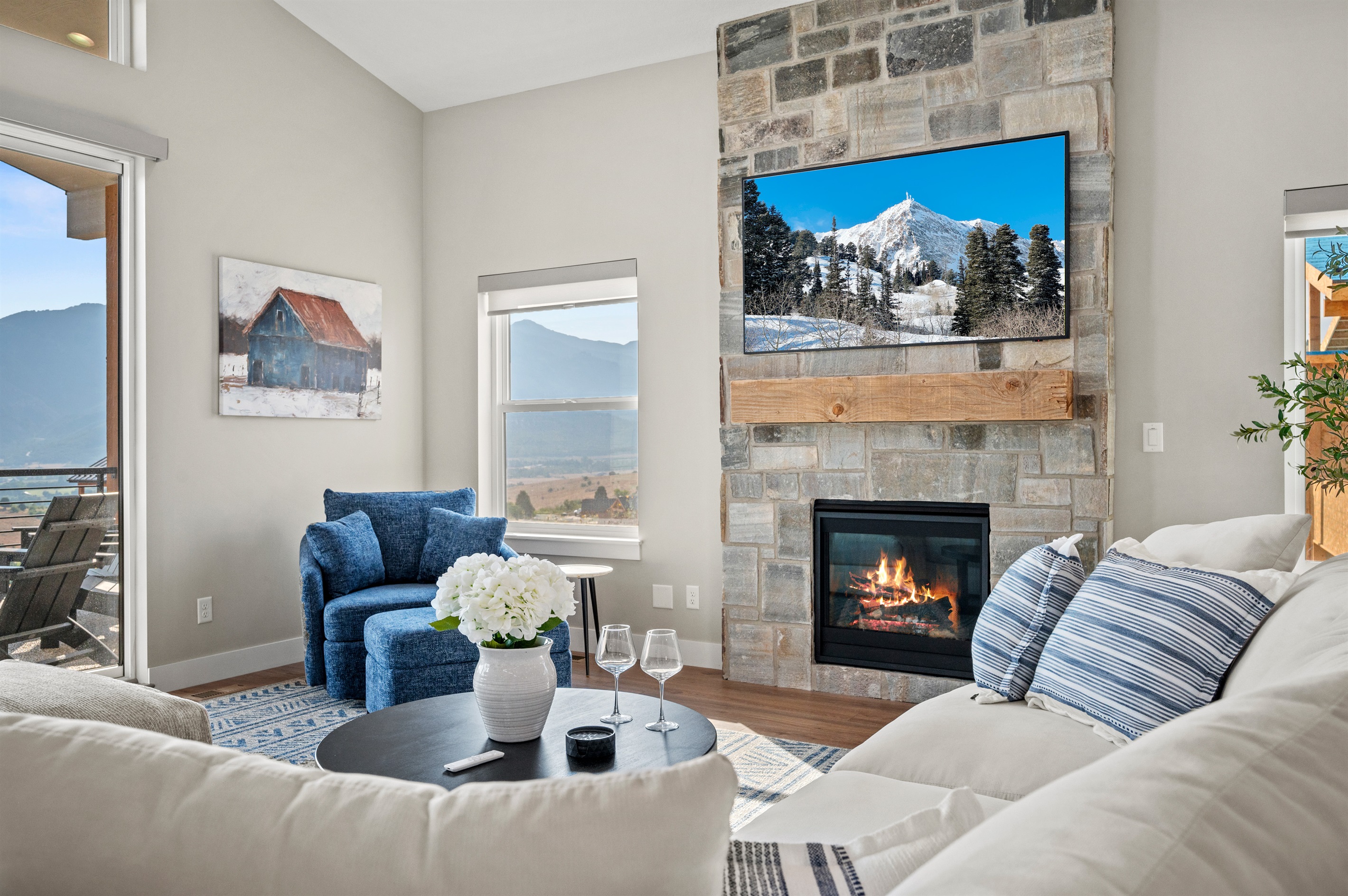 Soak in breathtaking mountain views from the living room with seamless access to the deck.