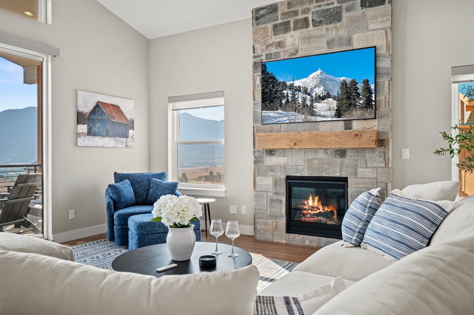 Soak in breathtaking mountain views from the living room with seamless access to the deck.