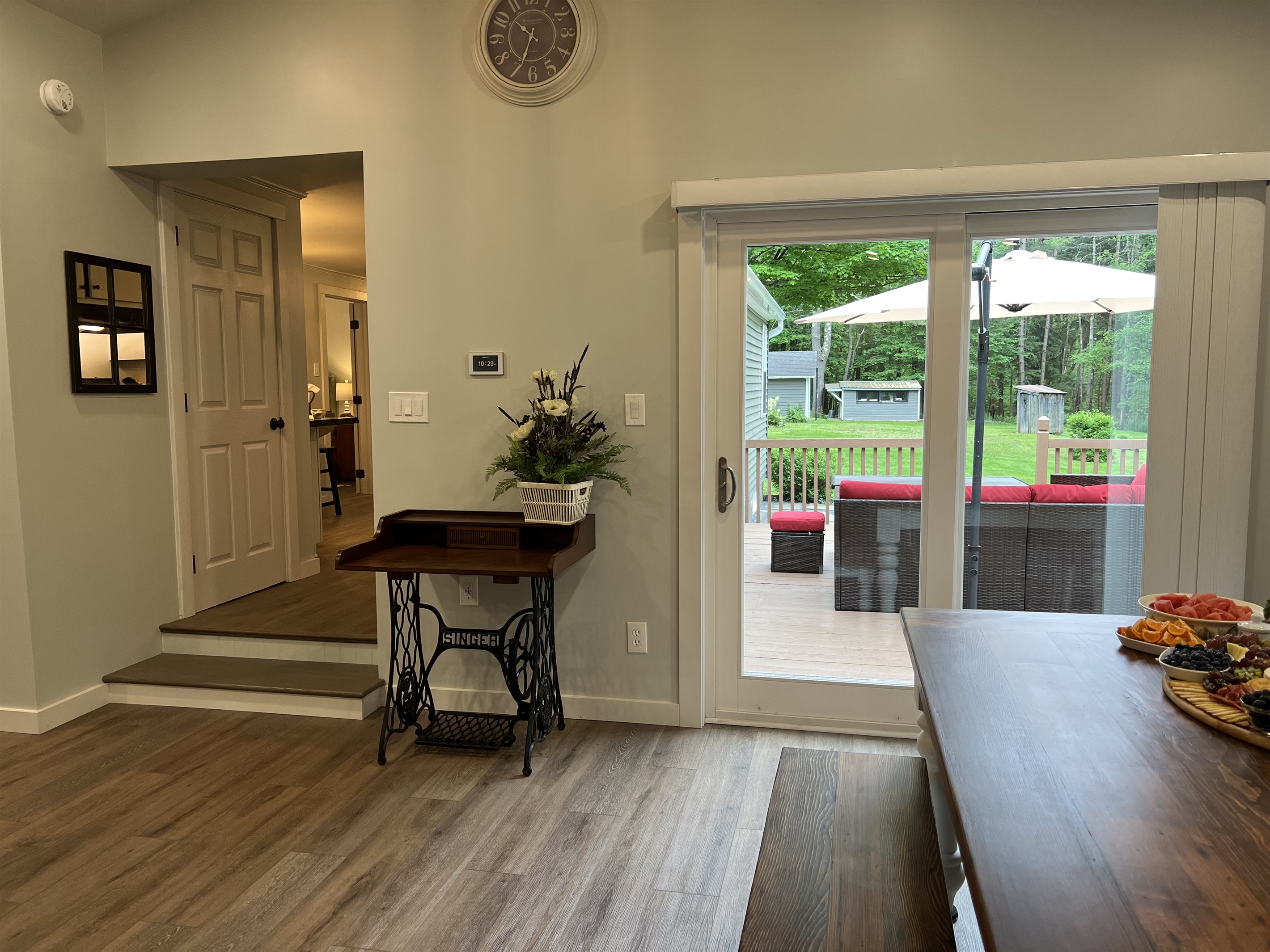 Sliding doors to rear deck and steps to kitchen