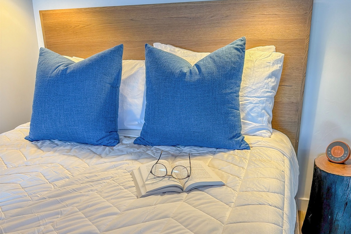 Enjoy reading while listening to the calming sounds coming from the little white-noise maker on the nightstand.