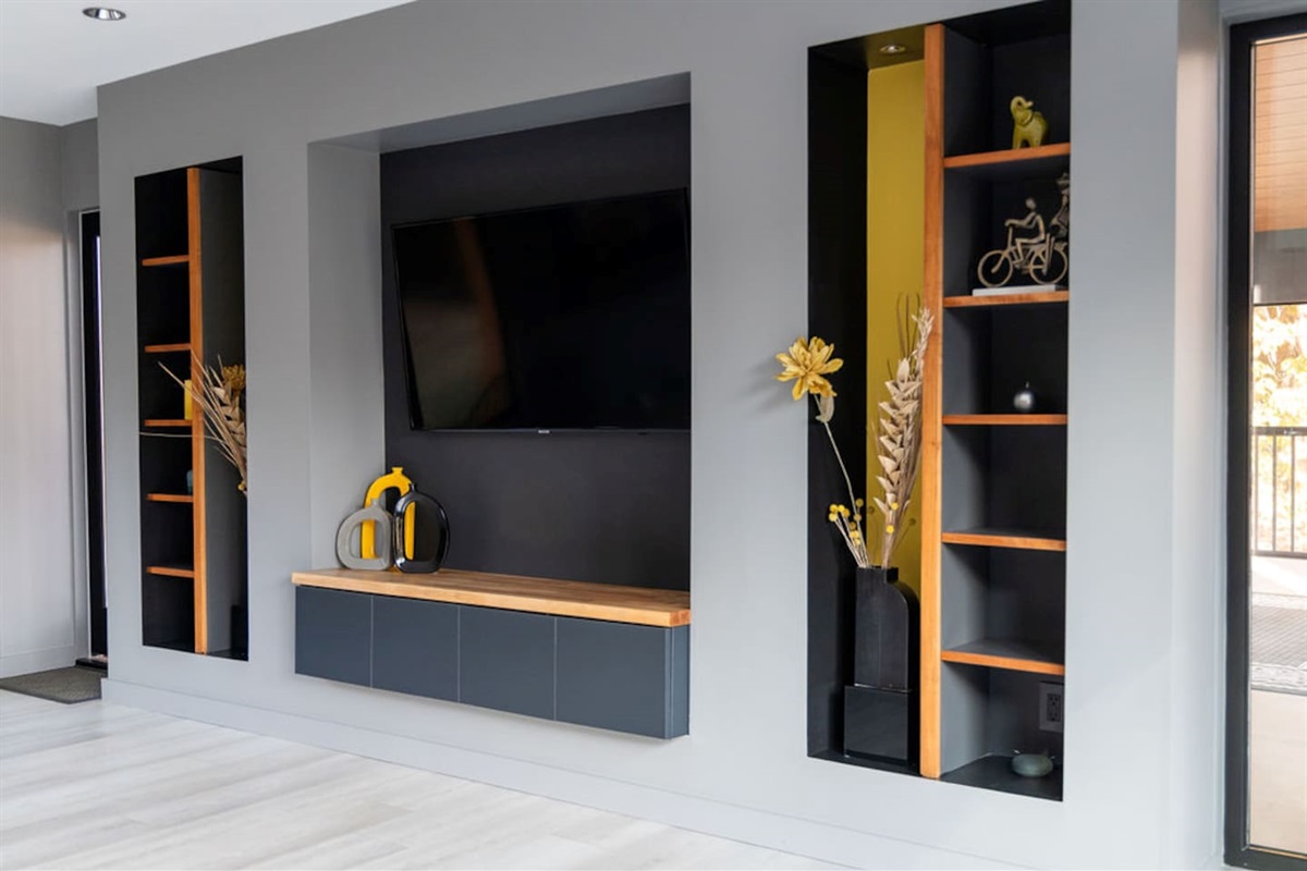 Large flat-screen TV in the living room, perfect for movie nights or catching up on your favorite shows in comfort and style.