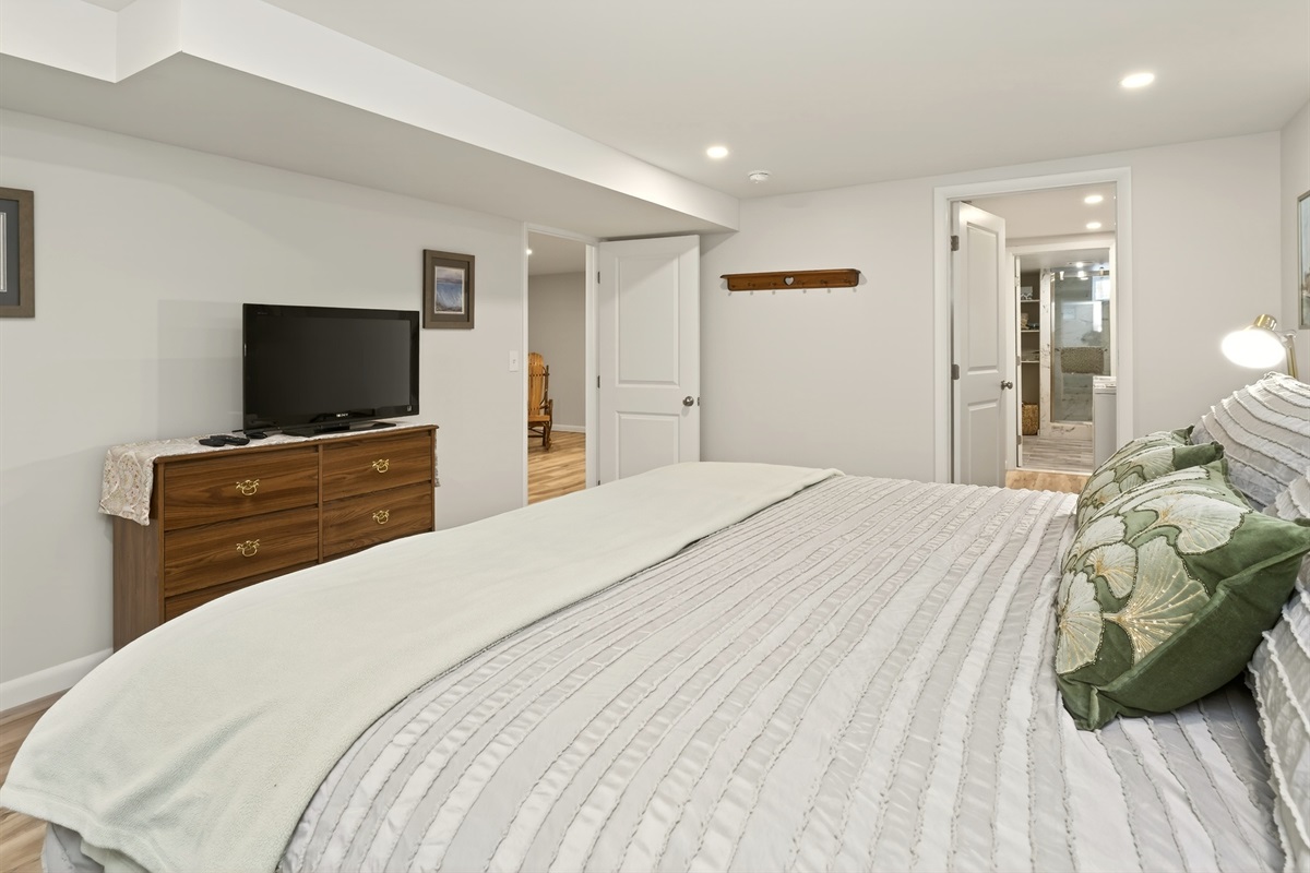 Lower level king bedroom with access to laundry room and full bathroom