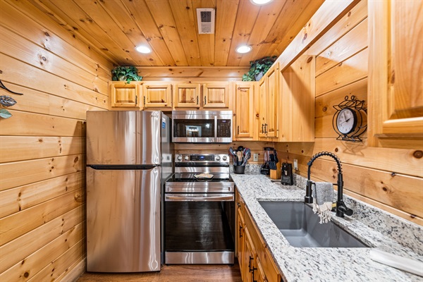 Full kitchen with coffee machine and tea kettle 