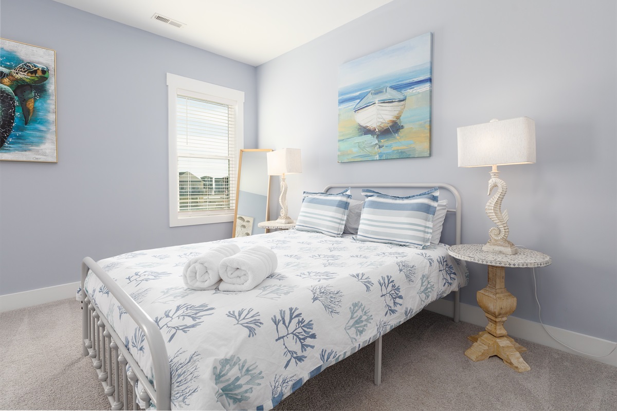 Bright and airy Top floor bedroom featuring a comfortable Queen bed with coastal-inspired decor