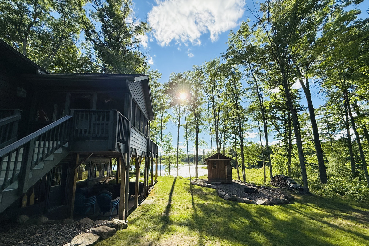 Our authentic wood burning sauna with a great view of the lake.