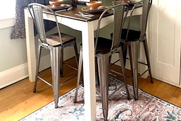 Kitchen dining nook with seating for four, perfect for meals, coffee, or planning the day.